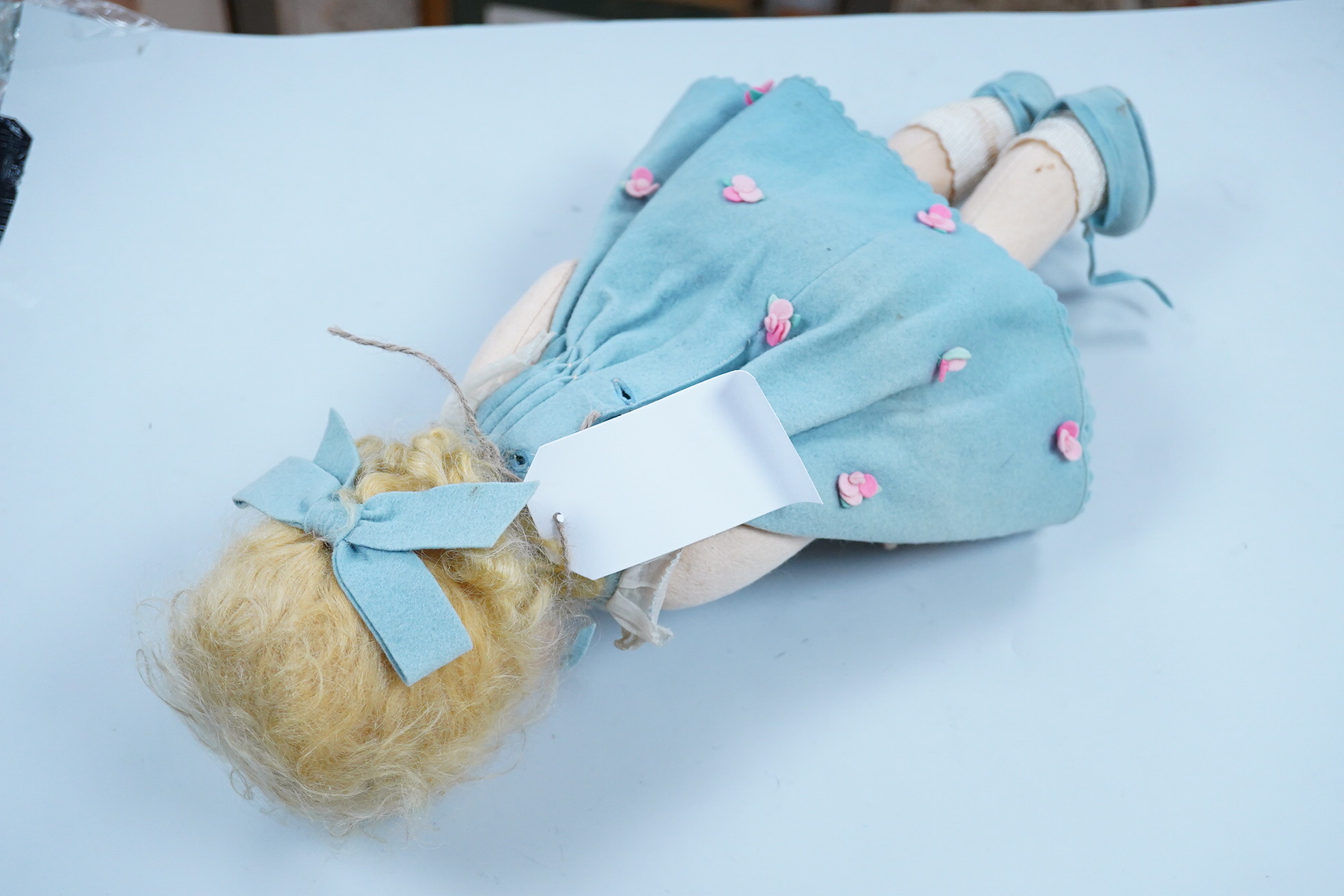 A wool felt Lenci doll with painted features to the face, 42cm long